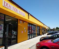 The yellow and orange Desi India Bazaar shopfront on Branham Lane, with parking directly outside